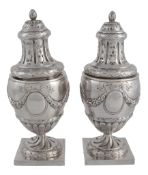 A pair of Continental silver coloured sugar casters, pseudo marks, Dutch import tax marks, early