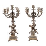 A pair of Italian silver coloured four branch five light candelabra by Arno Fassi, Milan, 1944-68 .
