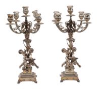 A pair of Italian silver coloured four branch five light candelabra by Arno Fassi, Milan, 1944-68 .