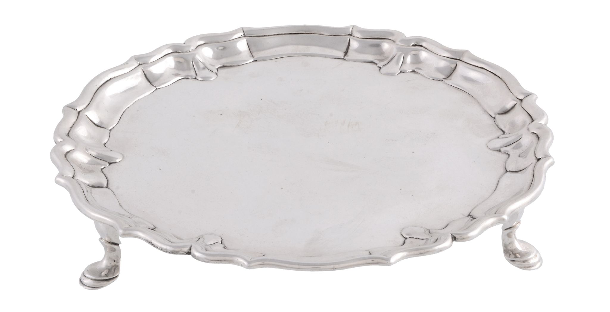 A George II silver shaped circular waiter by John Tuite, London 1736, with a raised moulded border,