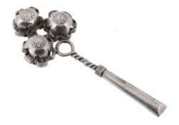 A silver coloured baby's rattle, stamped T97 only, early 20th century, with three spherical rattles