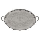 A late Victorian silver shaped oval twin handled tray by Henry Wilkinson & Co., London 1894, the