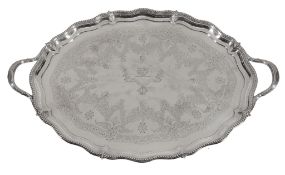 A late Victorian silver shaped oval twin handled tray by Henry Wilkinson & Co., London 1894, the