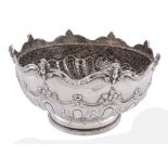 A late Victorian silver pedestal rose bowl by Charles Stuart Harris, London 1897, with a cherub