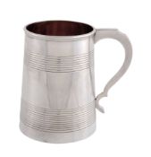 A Victorian silver tapered mug by Robert Harper, London 1859, with a double scroll handle, two