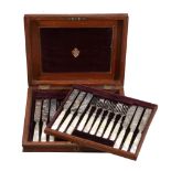 A set of twelve Victorian silver and mother of pearl handled fruit knives and forks, mark of Stokes