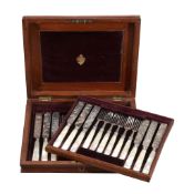 A set of twelve Victorian silver and mother of pearl handled fruit knives and forks, mark of Stokes