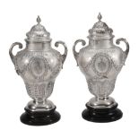 A pair of late Victorian silver presentation vases and covers by Harris Brothers, London 1896, ogee