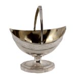 A George III silver navette pedestal sugar basket by Peter Podio, London 1797, with a swing handle,