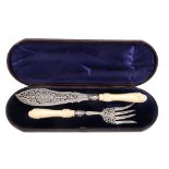 A pair of Victorian silver fish servers by Martin, Hall & Co., Sheffield 1870, with part scroll