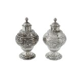 A pair of George II English provincial silver ogee baluster tea caddies by Isaac Cookson, Newcastle