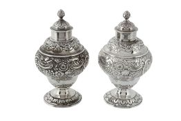 A pair of George II English provincial silver ogee baluster tea caddies by Isaac Cookson, Newcastle