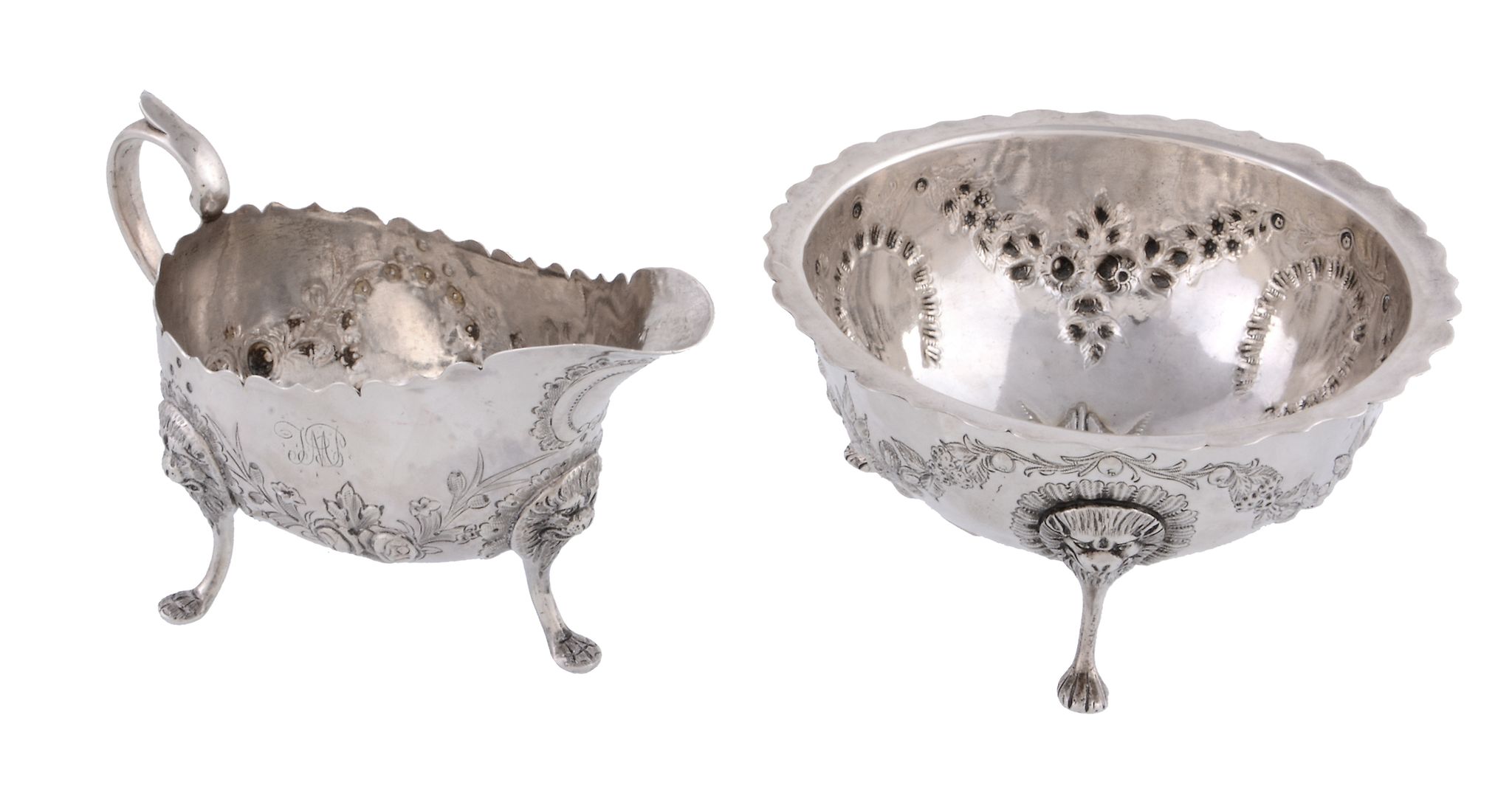 A Victorian Irish silver cream jug and sugar bowl by John Smith, Dublin 1879, embossed with floral