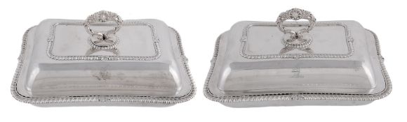 A pair of George IV silver entree dishes, covers and handles, maker's mark WE , London 1823, the