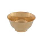 A Japanese gold coloured sake cup, stamped marks, 20th century, the bowl exterior hammered, on a