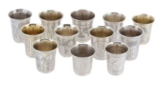 Eleven Russian silver charka or vodka tots, various makers and pre Kokoshnik and both Kokoshnik