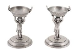 A pair of Austro-Hungarian silver figural salt cellars, maker's mark WG (not traced), 1867-1872 .