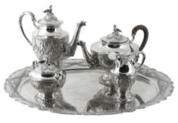 A German silver coloured four piece tea and coffee service on a tray, maker's mark not traced, post