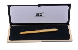 Montblanc, Meisterstuck 146, a gold plated fountain pen, the cap and barrel with engine turned