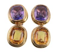 A pair of amethyst and citrine earrings, the oval shaped citrine in a reeded collet setting,