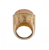 A citrine dress ring, the gallery chased with the outline of the Taj Mahal, with a facetted oval