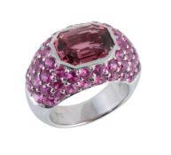 A pink tourmaline and pink sapphire ring, the canted corner rectangular shaped pink tourmaline