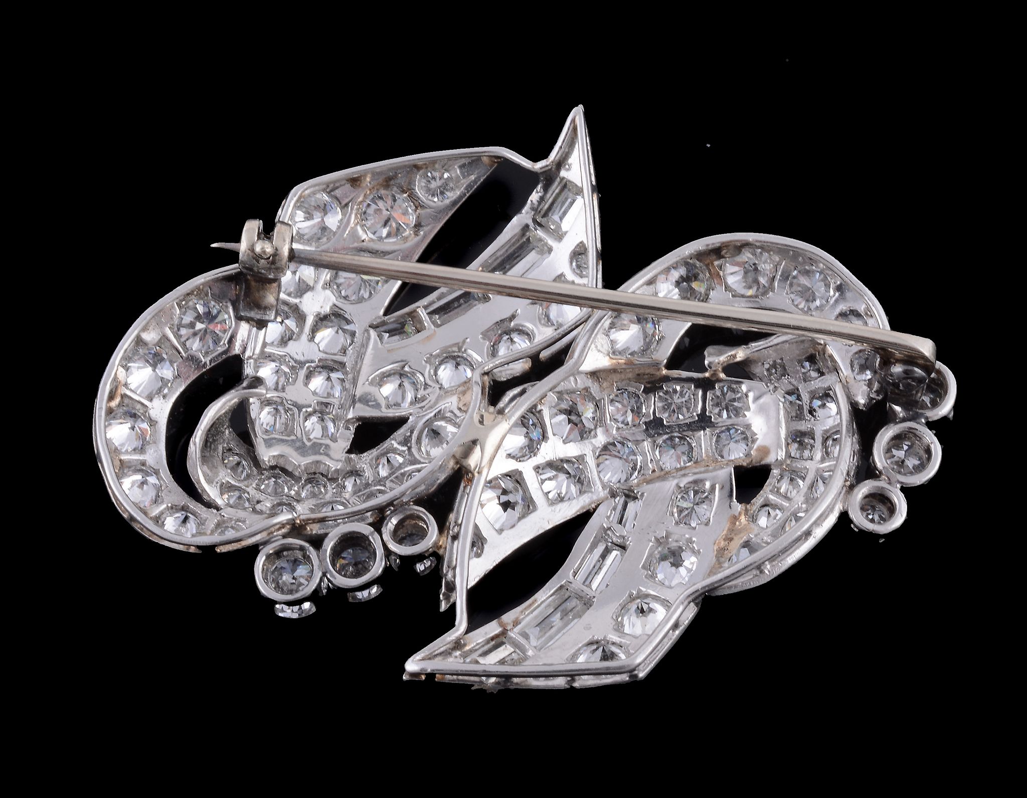 A 1950s diamond scroll brooch , the pierced scrolled panel set with brilliant and baguette cut - Image 2 of 2