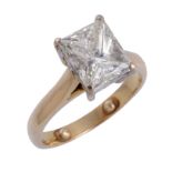 A diamond single stone ring, the rectangular princess cut weighing 2.01 carats, in a four claw