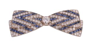 A sapphire and diamond bow brooch, set throughout with brilliant cut diamonds, approximately 1.60