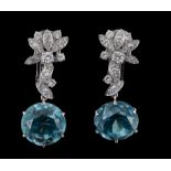 A pair of blue zircon and diamond earpendents, the round cut zircons suspended from brilliant cut