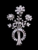 A diamond spray brooch, designed as a foliate spray, set throughout with brilliant cut, square cut,