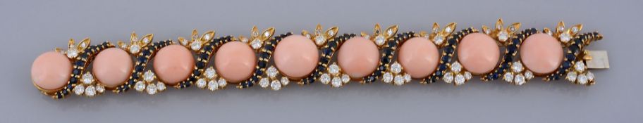 A coral, diamond and sapphire bracelet, the circular cabochon corals with graduated round cut