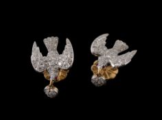 A pair of diamond and ruby Saint Espirt ear studs, the pave set diamond doves with cabochon ruby