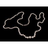 A natural pearl necklace, the one hundred and twenty nine graduated pearls measuring 6.6-7.2mm to