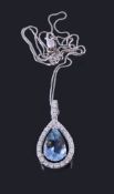 A diamond and aquamarine pendant, the pear cut aquamarine suspended within a brilliant cut diamond