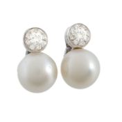 A pair of South Sea cultured pearl and diamond earrings, the 13.9mm South Sea cultured pearl set