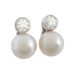 A pair of South Sea cultured pearl and diamond earrings, the 13.9mm South Sea cultured pearl set