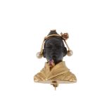 A blackamoor bust brooch, the carved black stone head with a cultured pearl and pink stone accented