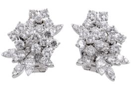 A pair of diamond earrings by Van Cleef & Arpels, designed as a foliate spray, set throughout with