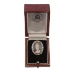 A mid 19th century portrait miniature and diamond ring, circa 1850, the oval panel painted with a