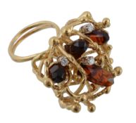 A citrine and diamond ring, the citrine crystals set within an abstract surround accented with