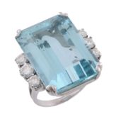 A diamond and aquamarine dress ring, the step cut aquamarine with canted corners, estimated to