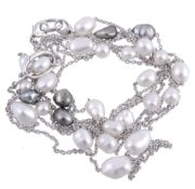 A cultured pearl necklace by Mikimoto, the two strand belcher link chain set along the line with