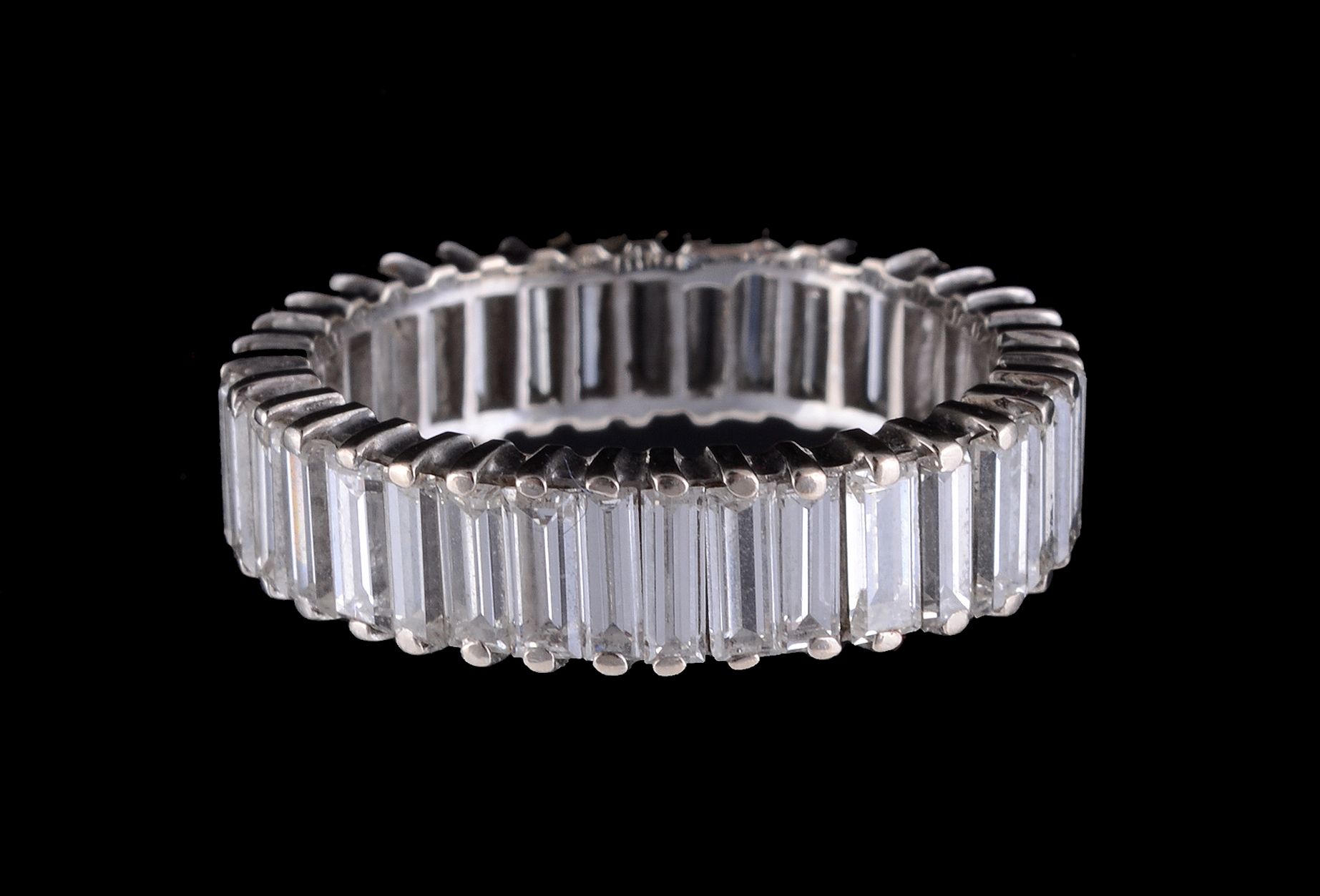 A diamond eternity ring, the baguette cut diamonds claw set, approximately 3.50 carats total, - Image 2 of 2