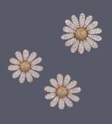 A pair of Marguerite diamond and yellow diamond ear clips and brooch by Van Cleef & Arpels, the ear