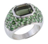 A green tourmaline and tsavorite garnet ring, the canted corner rectangular shaped tourmaline