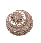 An early 20th century diamond set Middle Eastern star and crescent brooch, the gold setting with