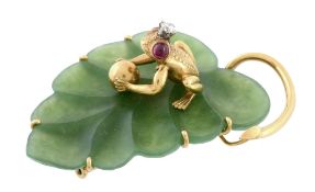 A nephrite, diamond and ruby frog and leaf brooch, the textured frog holding a polished ball with