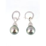 A pair of diamond and South Sea cultured pearl ear pendents, the diamond set earhoops with