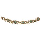 A fancy link emerald and ruby bracelet, the stylised dog shaped links with round cut ruby accents,